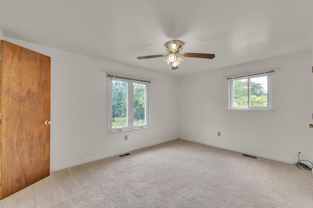 2145 Steeplechase Dr, Ann Arbor, MI 48103 - unfurnished room with healthy amount of natural light, a ceiling fan, and carpet