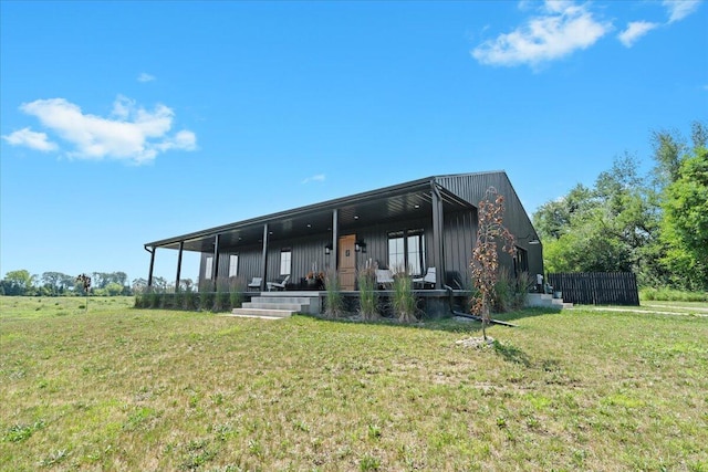 7499 Mathews Rd, Spring Arbor, MI 49283 - rear view of property featuring a lawn and a porch