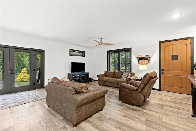 7499 Mathews Rd, Spring Arbor, MI 49283 - living room with light wood-style floors and ceiling fan