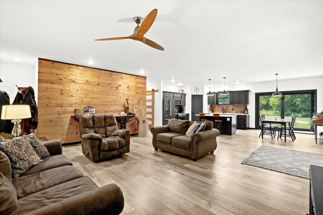 7499 Mathews Rd, Spring Arbor, MI 49283 - living room with ceiling fan, light wood finished floors, and recessed lighting