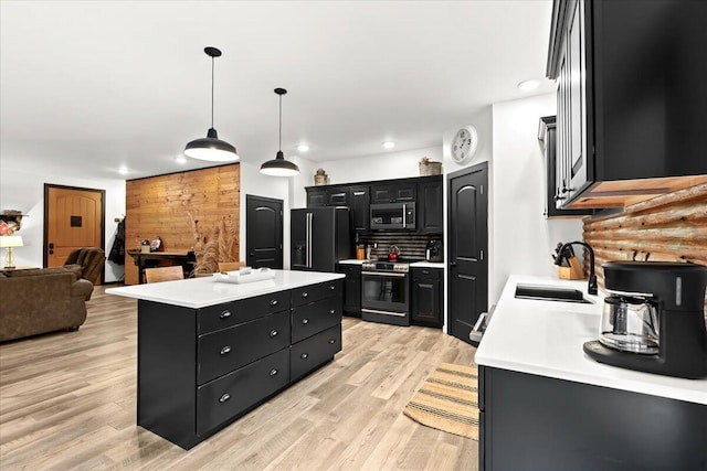 7499 Mathews Rd, Spring Arbor, MI 49283 - kitchen featuring electric range oven, dark cabinets, stainless steel microwave, black fridge with ice dispenser, and recessed lighting