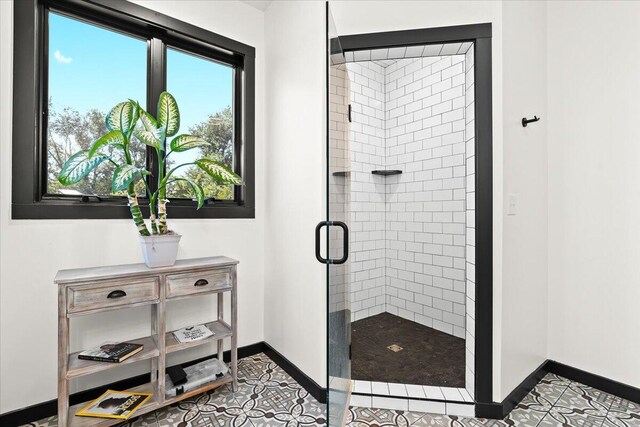 7499 Mathews Rd, Spring Arbor, MI 49283 - full bath featuring a shower stall and tile patterned floors