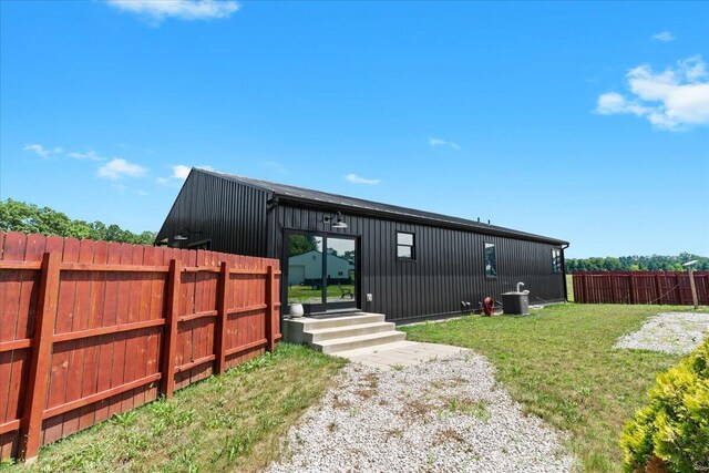 7499 Mathews Rd, Spring Arbor, MI 49283 - back of property with a fenced backyard and entry steps
