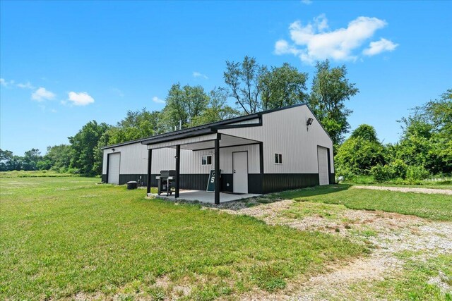 7499 Mathews Rd, Spring Arbor, MI 49283 - view of pole building featuring a yard