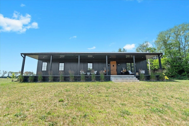 7499 Mathews Rd, Spring Arbor, MI 49283 - rear view of property featuring board and batten siding and a lawn