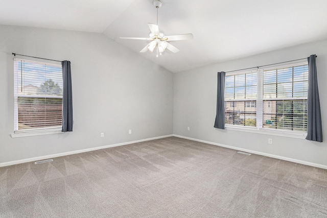 7400 Willow Creek Dr, Ypsilanti, MI 48197 - spare room with lofted ceiling, carpet flooring, healthy amount of natural light, and a ceiling fan