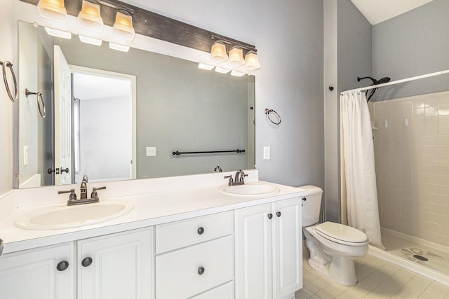 7400 Willow Creek Dr, Ypsilanti, MI 48197 - bathroom featuring a tile shower, double vanity, and tile patterned floors