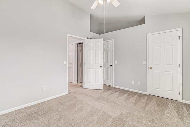 7400 Willow Creek Dr, Ypsilanti, MI 48197 - unfurnished bedroom with carpet, vaulted ceiling, and ceiling fan