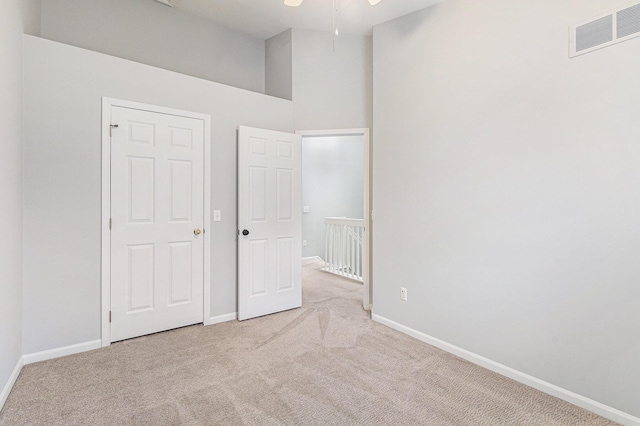 7400 Willow Creek Dr, Ypsilanti, MI 48197 - unfurnished bedroom featuring carpet and a towering ceiling