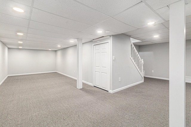 7400 Willow Creek Dr, Ypsilanti, MI 48197 - finished below grade area with carpet floors, stairs, and a paneled ceiling