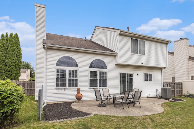 7400 Willow Creek Dr, Ypsilanti, MI 48197 - rear view of property with a patio, a chimney, and a shingled roof