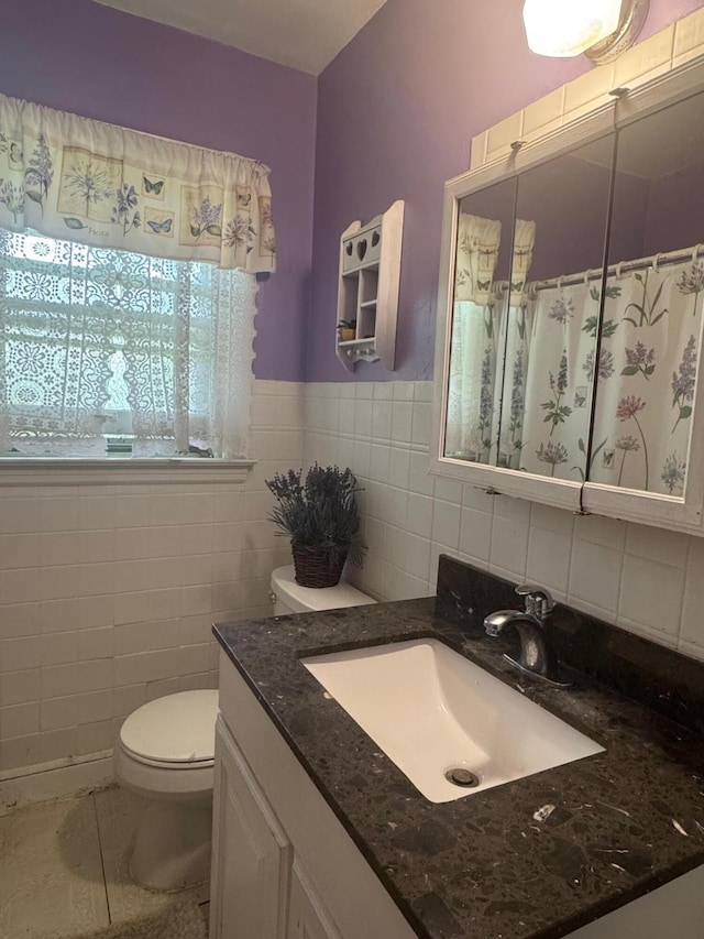 111 Butternut St, Three Oaks, MI 49128 - full bath featuring vanity, tile walls, a shower with shower curtain, and a wainscoted wall