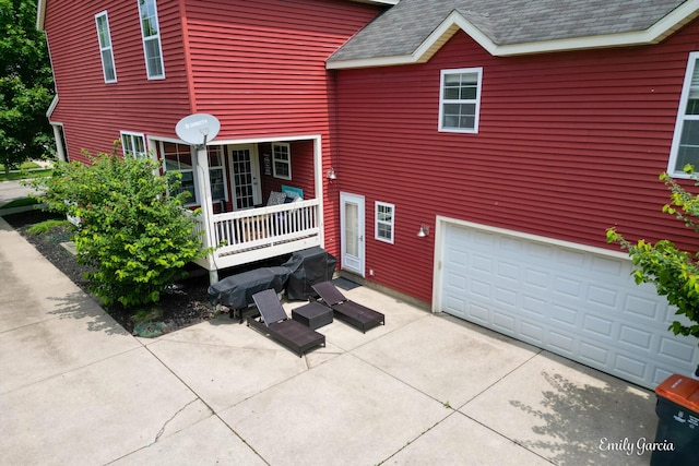 622 Cedar Square St, Holland, MI 49423 - view of front of property featuring a shingled roof, an attached garage, and concrete driveway