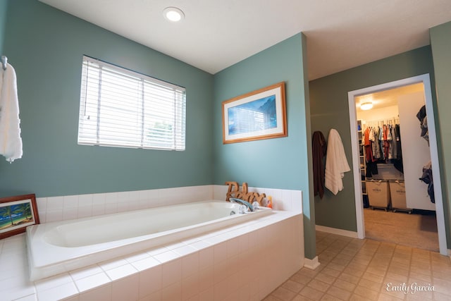 622 Cedar Square St, Holland, MI 49423 - bathroom featuring a garden tub and a spacious closet