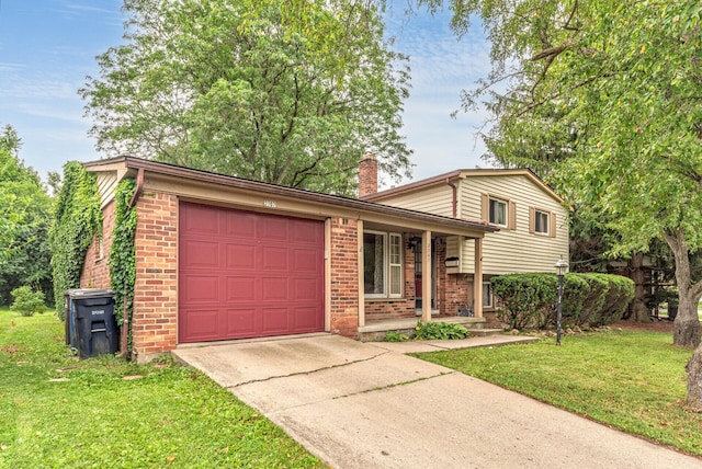 2707 Brandywine Dr, Ann Arbor, MI 48104 - split level home with brick siding, an attached garage, driveway, a chimney, and covered porch