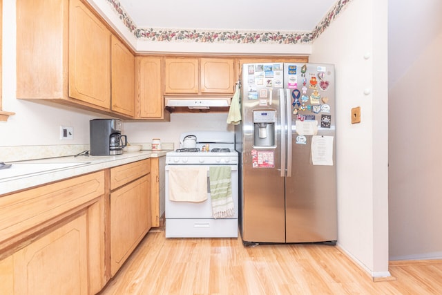2707 Brandywine Dr, Ann Arbor, MI 48104 - kitchen featuring stainless steel refrigerator with ice dispenser, white gas stove, light brown cabinets, under cabinet range hood, and light wood-style flooring