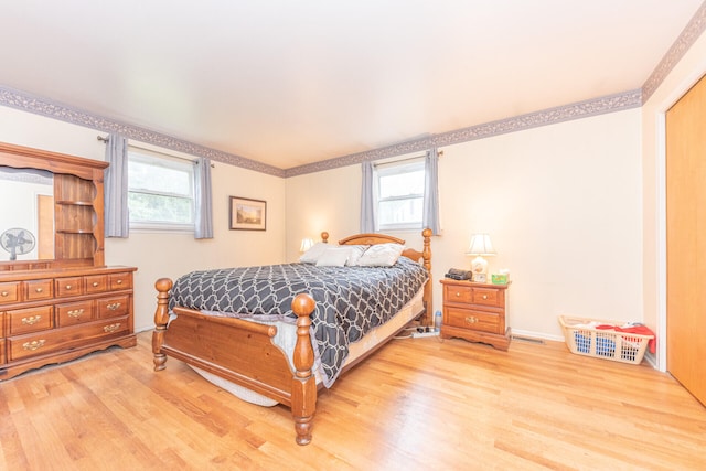 2707 Brandywine Dr, Ann Arbor, MI 48104 - bedroom featuring wood finished floors, multiple windows, and crown molding