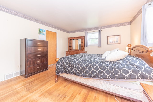 2707 Brandywine Dr, Ann Arbor, MI 48104 - bedroom with wood finished floors and crown molding