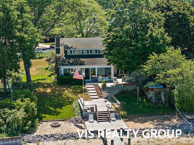 537 Buena Vista Dr, Spring Lake, MI 49456 - view of front facade featuring a deck, stairway, and a front yard