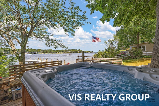 537 Buena Vista Dr, Spring Lake, MI 49456 - view of swimming pool featuring a hot tub and a water view