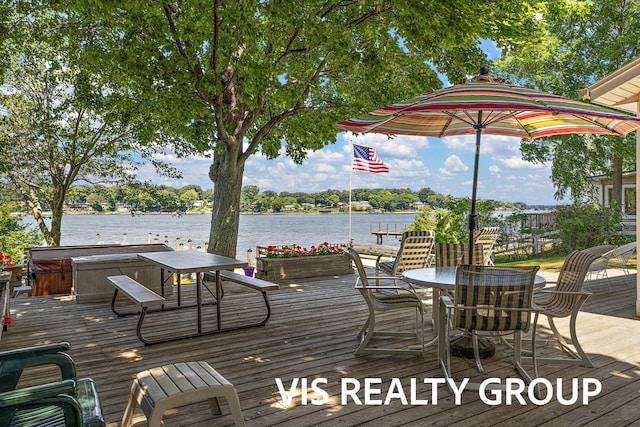 537 Buena Vista Dr, Spring Lake, MI 49456 - wooden deck featuring a hot tub, a water view, and outdoor dining space