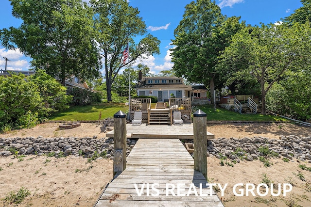 537 Buena Vista Dr, Spring Lake, MI 49456 - back of house with an outdoor fire pit