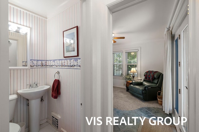 537 Buena Vista Dr, Spring Lake, MI 49456 - bathroom featuring a ceiling fan and wallpapered walls
