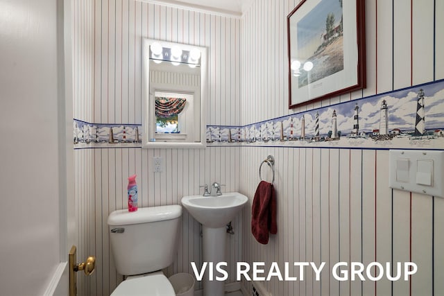 537 Buena Vista Dr, Spring Lake, MI 49456 - bathroom with wallpapered walls and a wainscoted wall