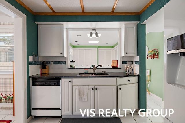 537 Buena Vista Dr, Spring Lake, MI 49456 - kitchen featuring dishwashing machine, tasteful backsplash, light tile patterned flooring, refrigerator, and white cabinets