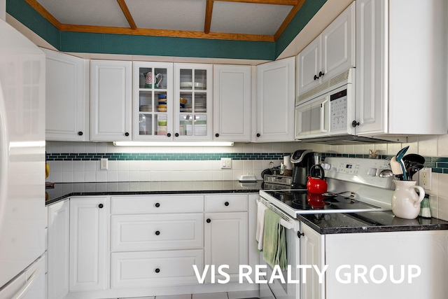 537 Buena Vista Dr, Spring Lake, MI 49456 - kitchen with white appliances, white cabinets, decorative backsplash, and glass insert cabinets