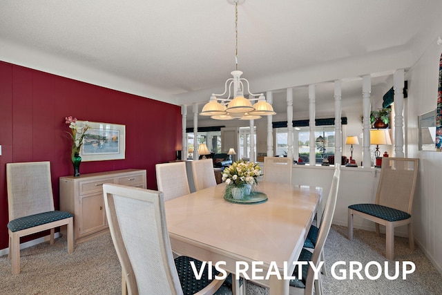 537 Buena Vista Dr, Spring Lake, MI 49456 - dining space featuring a chandelier and light carpet
