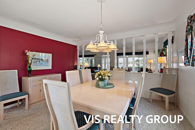 537 Buena Vista Dr, Spring Lake, MI 49456 - dining space featuring a chandelier and light colored carpet
