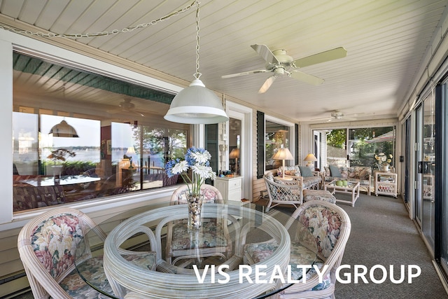 537 Buena Vista Dr, Spring Lake, MI 49456 - sunroom featuring ceiling fan, outdoor dining space, and a baseboard heating unit