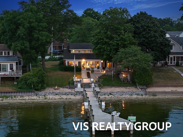 537 Buena Vista Dr, Spring Lake, MI 49456 - rear view of house with a deck with water view