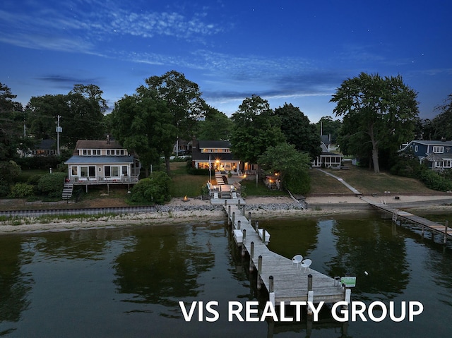 537 Buena Vista Dr, Spring Lake, MI 49456 - dock area with a boat ramp and a deck with water view