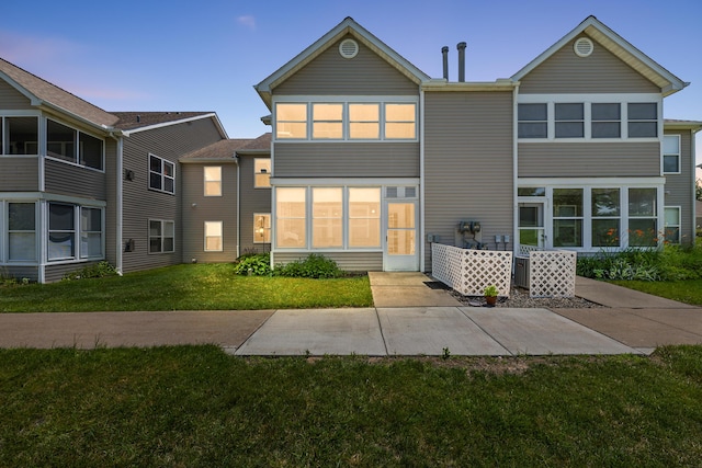 1734 Weatherstone Dr, Ann Arbor, MI 48108 - rear view of property featuring a lawn