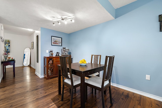 1734 Weatherstone Dr, Ann Arbor, MI 48108 - dining area with dark wood-type flooring, a textured ceiling, and arched walkways