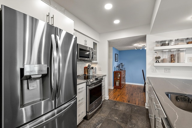 1734 Weatherstone Dr, Ann Arbor, MI 48108 - kitchen featuring stainless steel appliances, backsplash, white cabinets, recessed lighting, and stone countertops