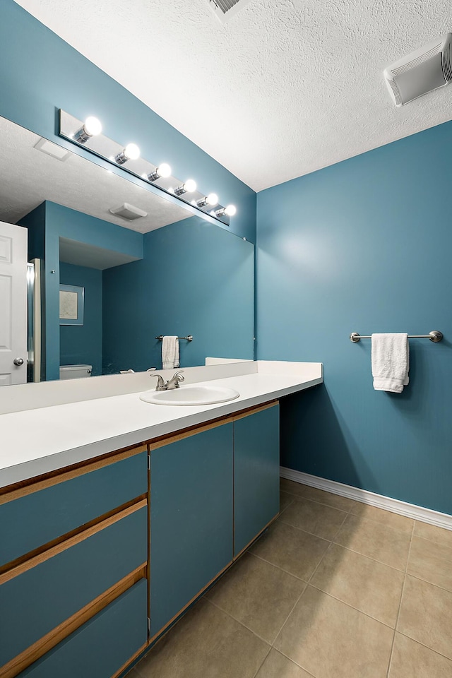 1734 Weatherstone Dr, Ann Arbor, MI 48108 - bathroom with vanity, tile patterned floors, and a textured ceiling