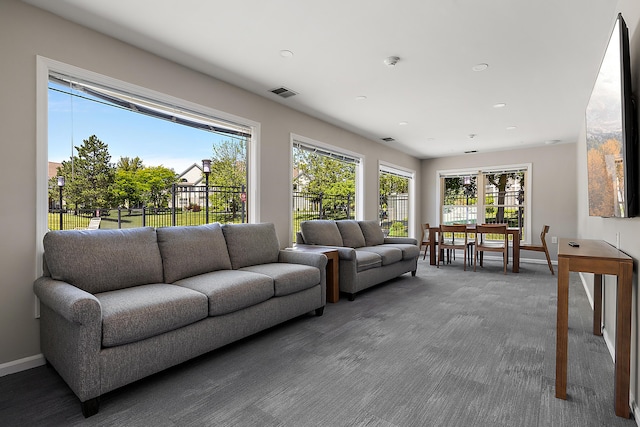 1734 Weatherstone Dr, Ann Arbor, MI 48108 - carpeted living area featuring baseboards and recessed lighting