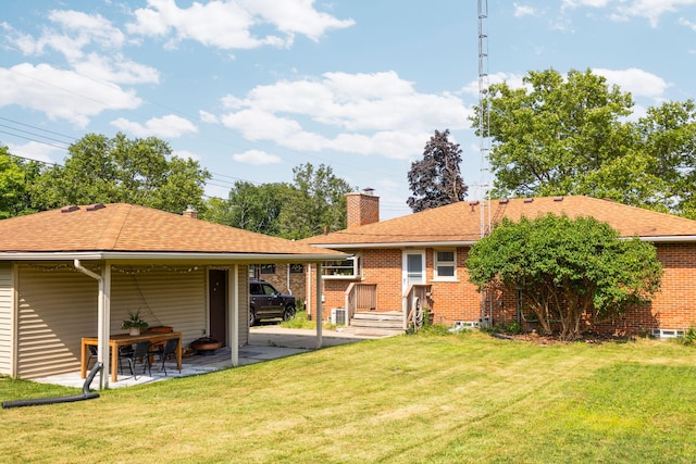 1534 Barrington Pl, Ann Arbor, MI 48103 - rear view of property featuring a chimney, a lawn, and a shingled roof