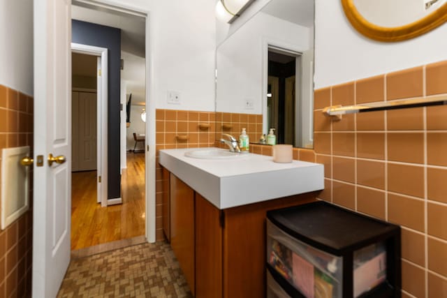1534 Barrington Pl, Ann Arbor, MI 48103 - bathroom with tile walls, vanity, and wainscoting