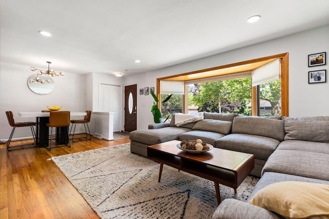 1534 Barrington Pl, Ann Arbor, MI 48103 - living room with a chandelier, wood finished floors, and recessed lighting