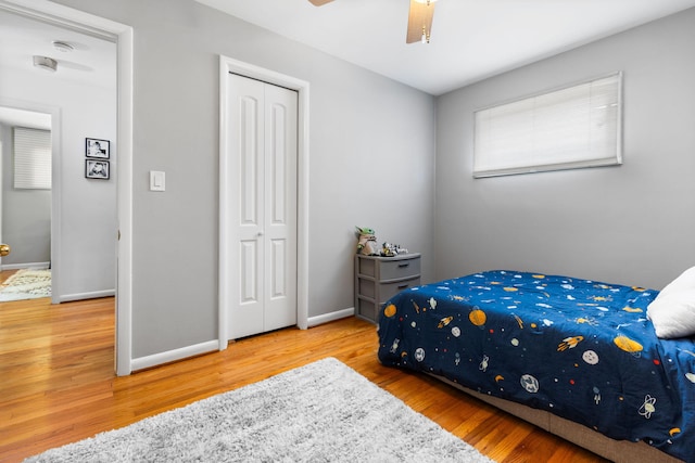 1534 Barrington Pl, Ann Arbor, MI 48103 - bedroom with wood finished floors, a closet, and a ceiling fan