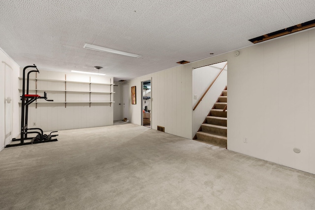 1534 Barrington Pl, Ann Arbor, MI 48103 - finished below grade area with carpet, stairs, and a textured ceiling