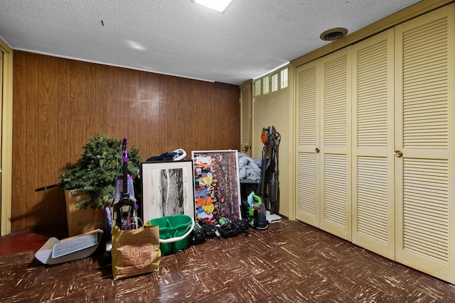 1534 Barrington Pl, Ann Arbor, MI 48103 - recreation room with wood walls and tile patterned floors