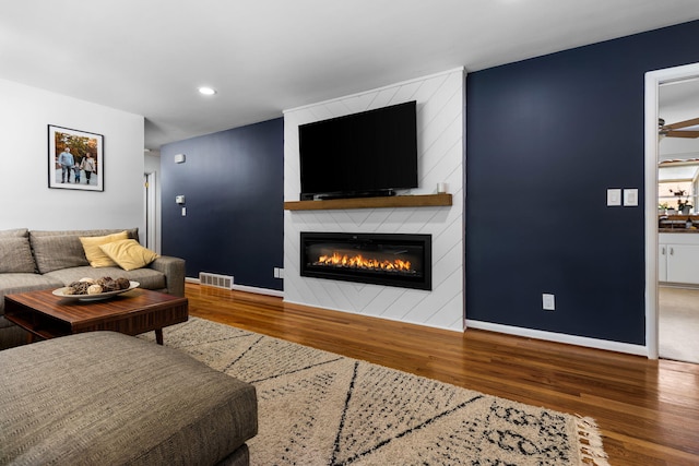 1534 Barrington Pl, Ann Arbor, MI 48103 - living room featuring wood finished floors, a fireplace, and recessed lighting