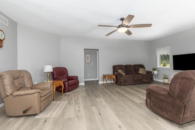 23103 13 Mile Rd, Big Rapids, MI 49307 - living area featuring a ceiling fan and light wood-type flooring