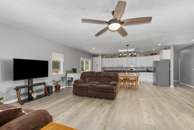 23103 13 Mile Rd, Big Rapids, MI 49307 - living room featuring ceiling fan, light wood-type flooring, and recessed lighting