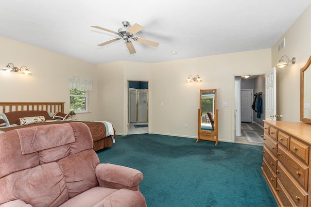 23103 13 Mile Rd, Big Rapids, MI 49307 - bedroom with ensuite bath, a spacious closet, dark colored carpet, and ceiling fan